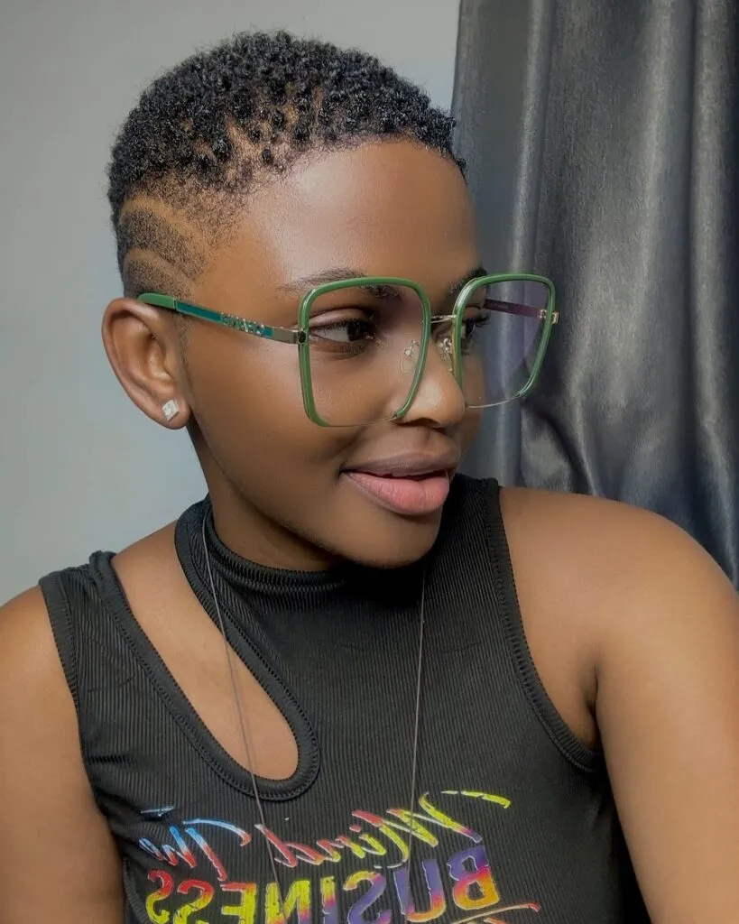 Tapered Afro with Shaved Designs Tapered Afro with Shaved Designs