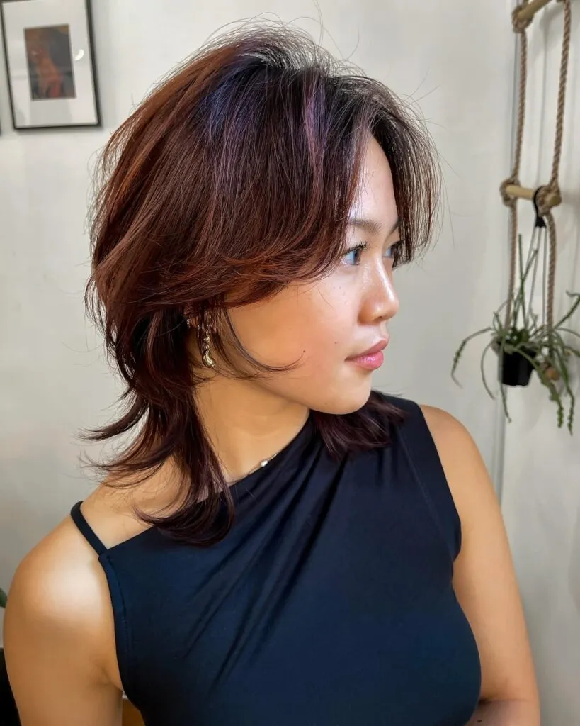 Voluminous Wolf Cut with Auburn Layers